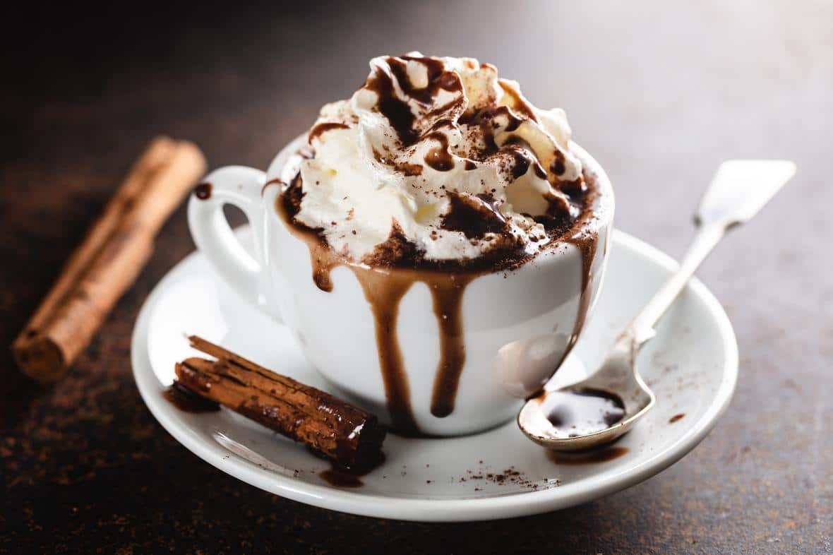 Beverage with coconut oil whipped topping